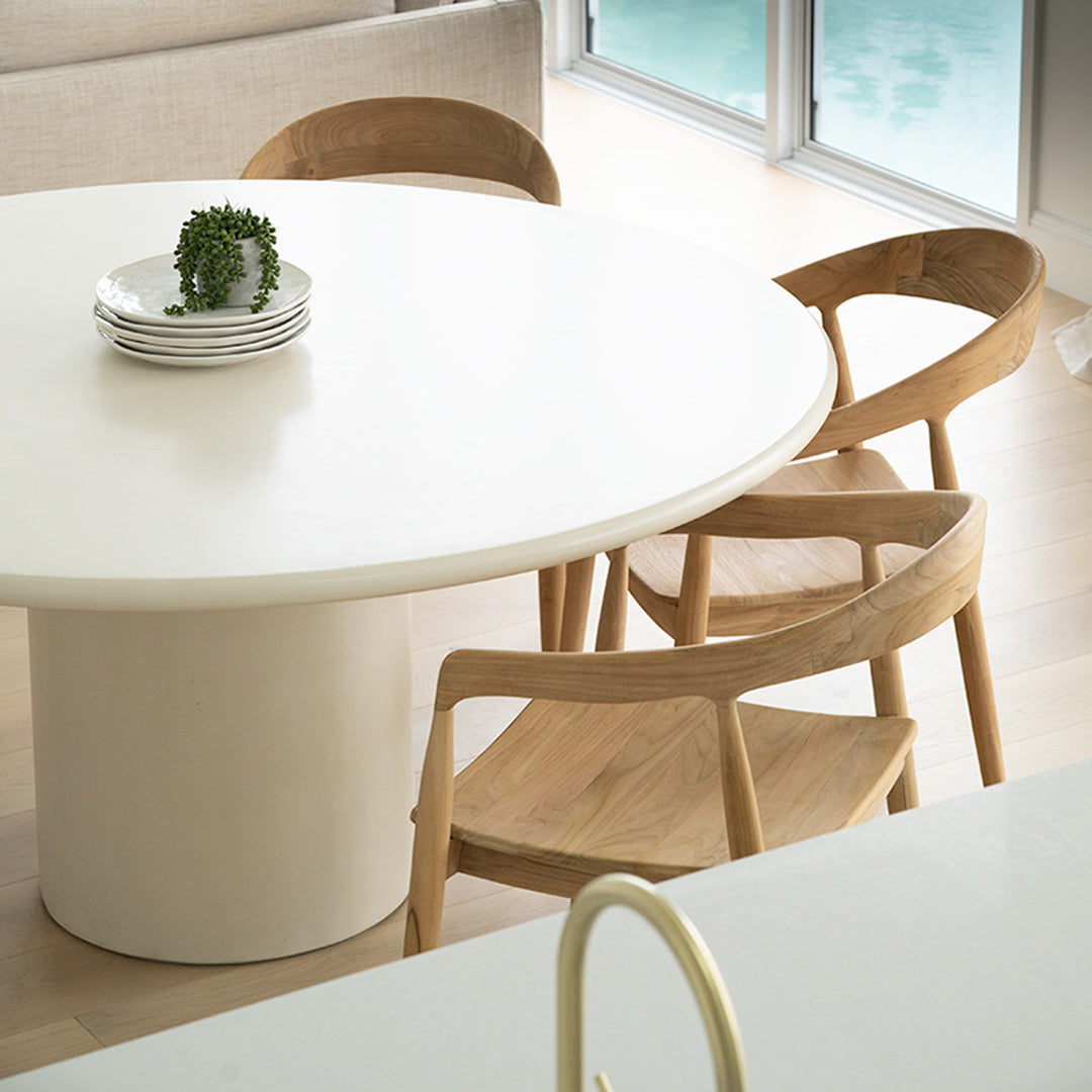 Overhead lifestyle view of Rigby Armchair – Natural paired with dining table in bright kitchen space.