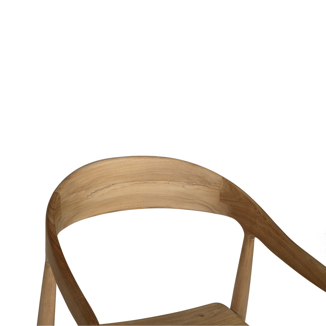 Close-up angled view of Rigby Armchair – Natural highlighting smooth curved backrest.