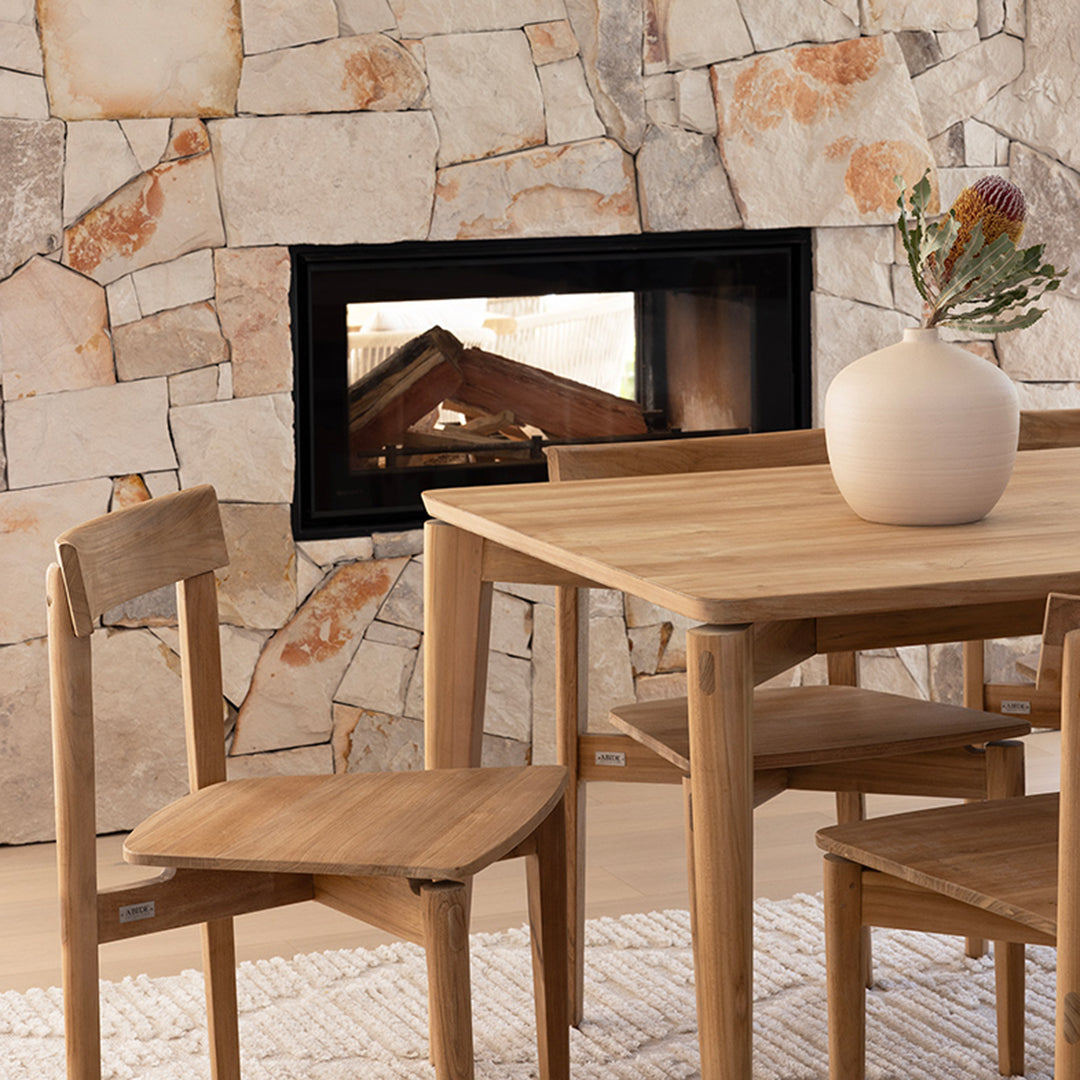 Lifestyle close-up of Jude Dining Chair – Natural styled beside dining table in modern home