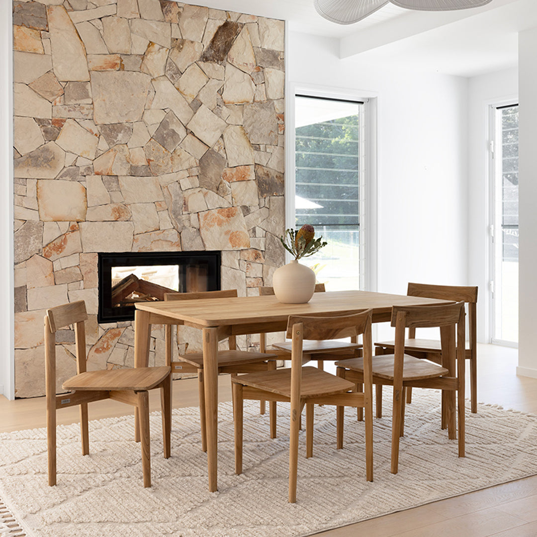 Angled lifestyle view of Jude Dining Chair – Natural paired with matching oak dining table