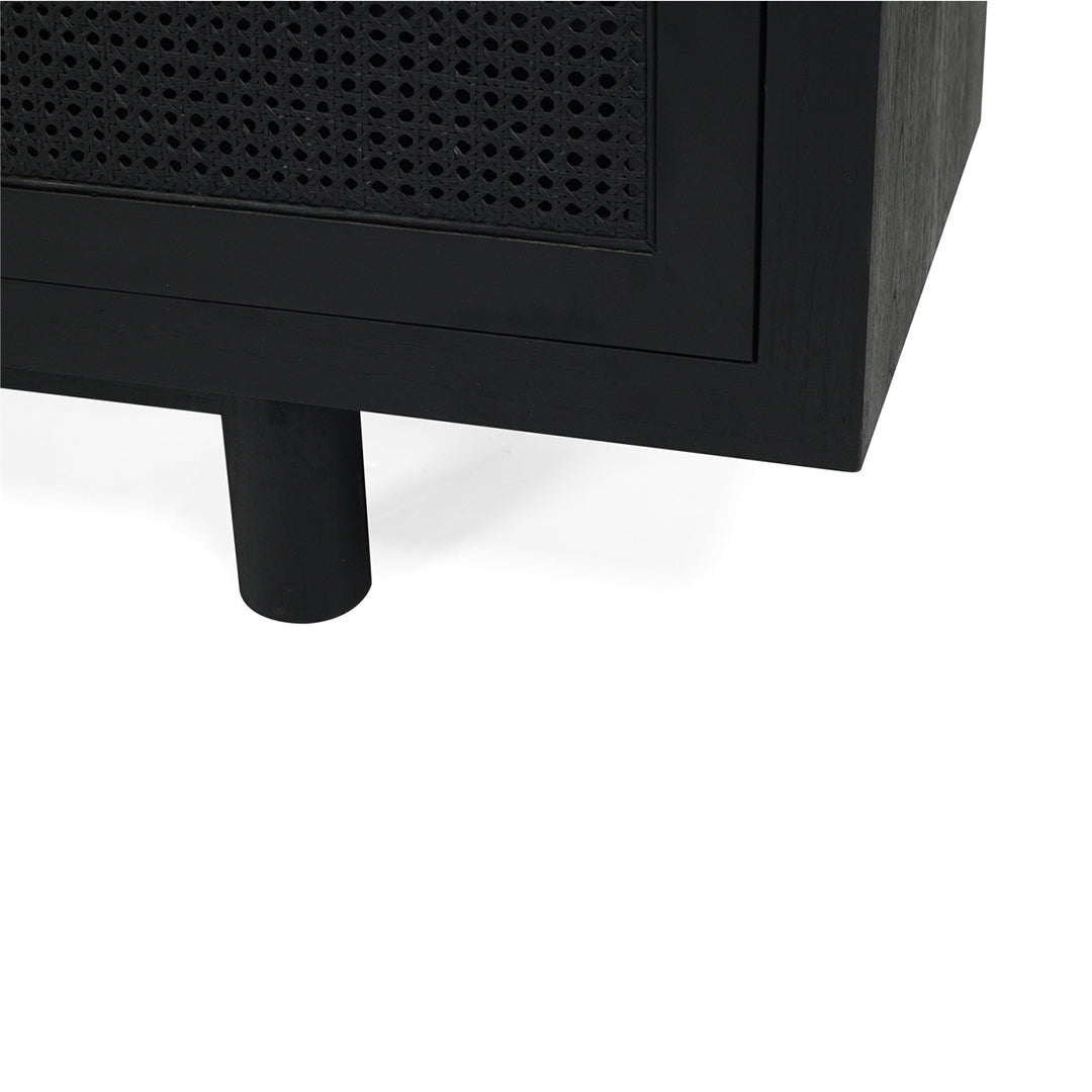 Corner view of Iluka Four Door Entertainment Unit – Black with round timber legs and cane panel door