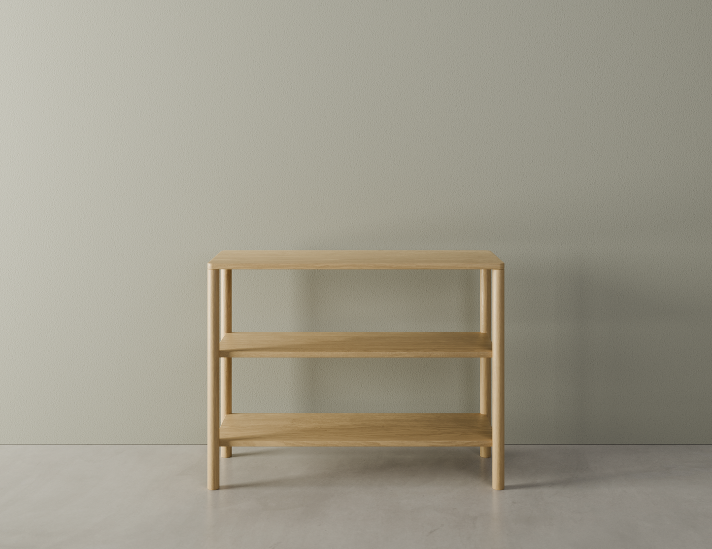 Front view of a 2 tier bookshelf made from American oak on a polished concrete floor.