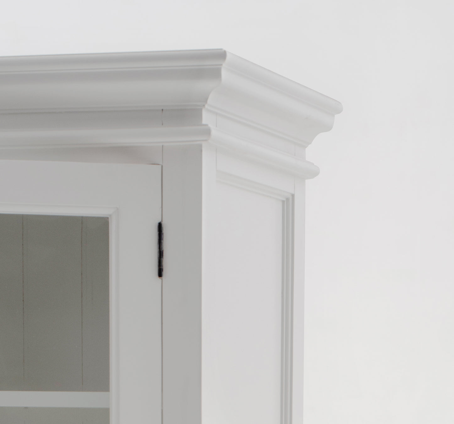 Close-up view of top corner of traditional 3 level white timber pantry cabinet with 6 glass doors.