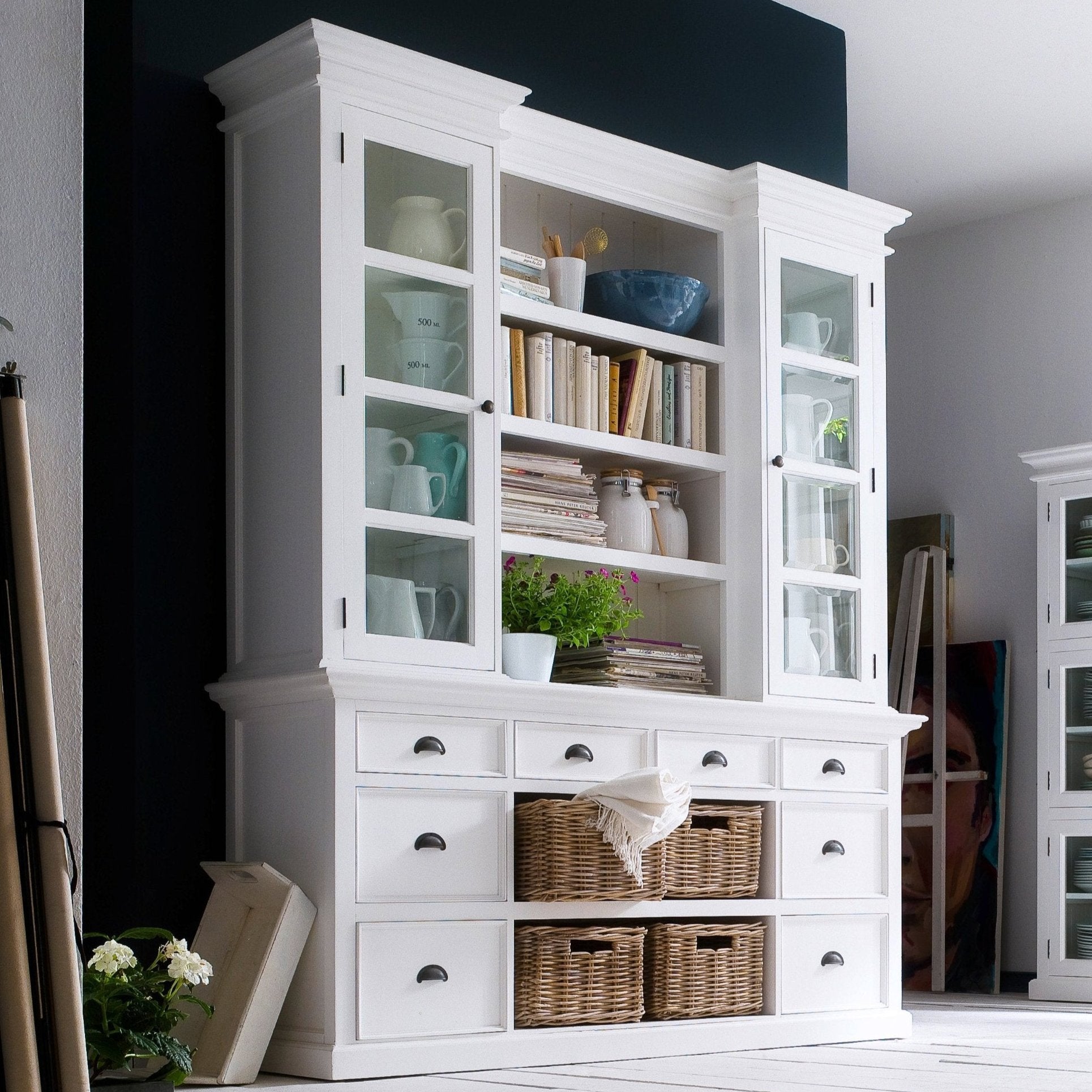 NovaSolo Halifax white wooden library hutch with 4 rattan baskets, 2 glass doors and 8 drawers with antique brass hardware.