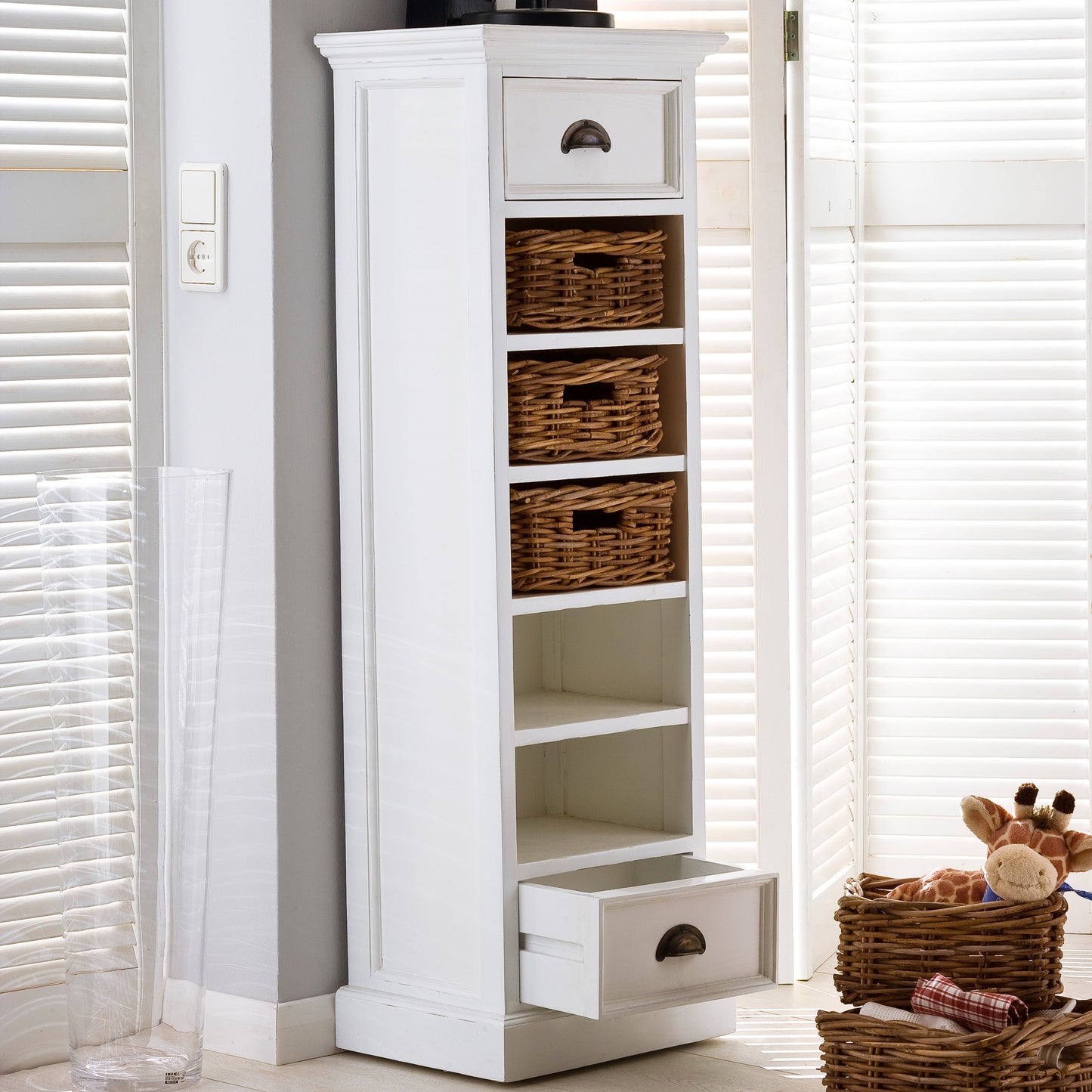 NovaSolo Halifax white wooden storage tower with 5 shelves, 3 rattan baskets and 2 drawers with antique brass hardware.