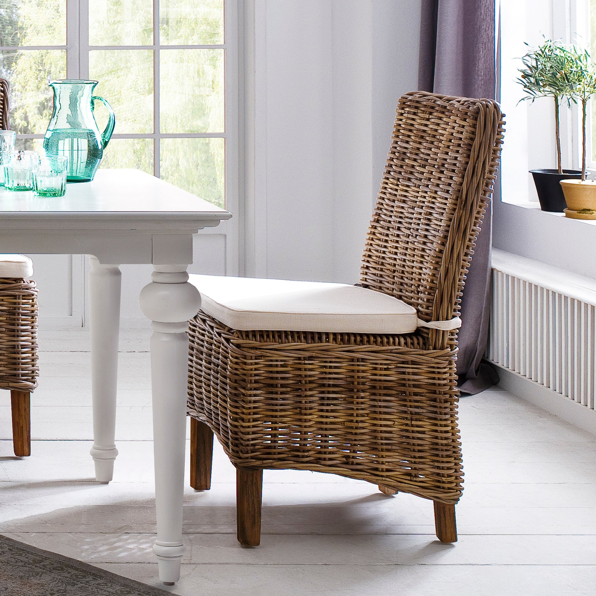 NovaSolo Wickerworks Morin dining chair with cushion (set of 2) made from kubu rattan and mahogany.