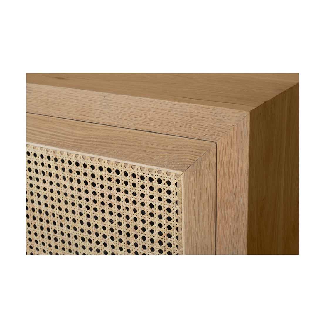 Side angled detail of Iluka Sideboard - Two Door showing oak frame and rattan weave.