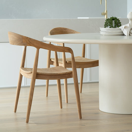 Side lifestyle view of Rigby Armchair – Natural styled around dining setting.