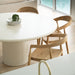Overhead lifestyle view of Rigby Armchair – Natural paired with dining table in bright kitchen space.