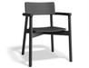 Three-quarter front view of Andi Armchair Black chair, showcasing sculpted seat, rounded armrests, sturdy frame, and modern Scandinavian aesthetic in a matte black wood finish on a clean background.
