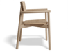 Side profile of Andi Armchair Natural solid oak dining chair, showcasing sculpted backrest, smooth integrated armrests, contoured seat, and tapered legs against a clean white background.