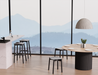 Andi Backless Bar Stool - Black - 66 cm Seat Height displayed in a bright dining area with large windows and mountain views, showcasing clean lines and modern interior styling.