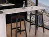 Pair of Andi Backless Bar Stool - Black - 75 cm Seat Height stools styled at a contemporary kitchen island with marble countertop, emphasising sleek design, functional seating, and black timber finish.