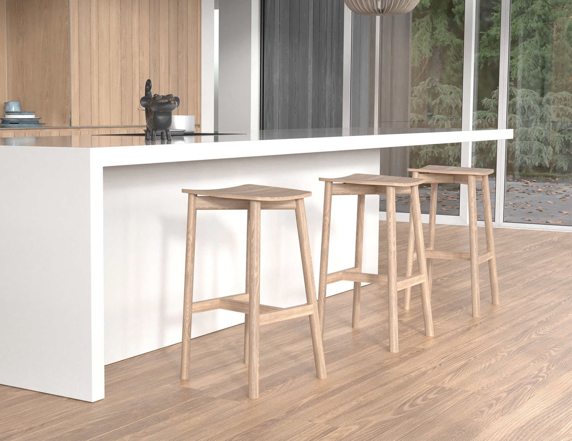 Close-up lifestyle view of Andi Backless Bar Stool - Natural - 75 cm Seat Height positioned near a kitchen island, highlighting smooth curved seat edges, natural oak grain detail, and sturdy footrest design.