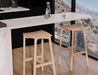 Pair of Andi Backless Bar Stool - Natural - 75 cm Seat Height stools positioned at a marble kitchen island, emphasising durability, minimalist form, and warm wood tones.