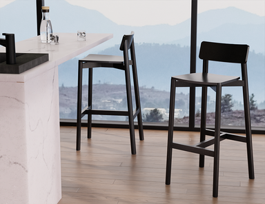 Modern kitchen setting with Andi Bar Stool - Black - 66 cm Seat Height stools near a large window, showcasing sleek black finish and minimalist aesthetic.
