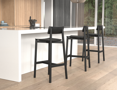 Bar counter setup with multiple Andi Bar Stool - Black - 75 cm Seat Height stools, highlighting uniform design, strong structure, and contemporary kitchen environment.