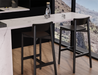 Two Andi Bar Stool - Black - 75 cm Seat Height stools placed at a marble kitchen island, emphasising clean lines, sturdy frame, and modern interior styling.