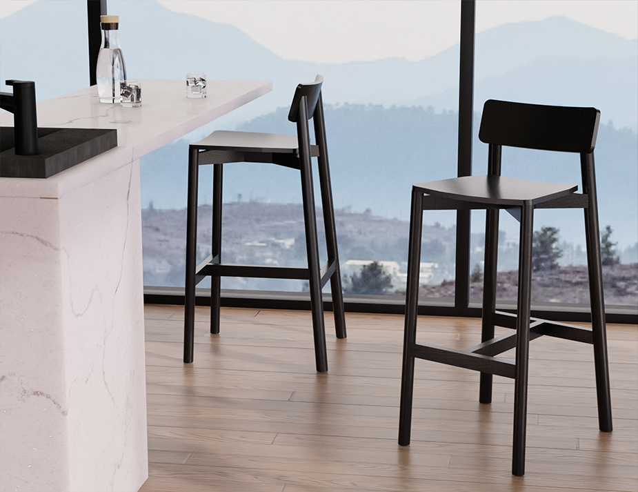 Modern kitchen setting with Andi Bar Stool - Black - 75 cm Seat Height stools near a large window, showcasing sleek black finish and minimalist aesthetic.