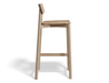 Side profile view of Andi Bar Stool - Natural - 75 cm Seat Height, isolated on a white background, showcasing solid wood frame, integrated footrest, and minimalist Scandinavian design.