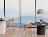 Contemporary dining space with round black table and Andi Bar Stool - Natural - 75 cm Seat Height seating, styled in a bright interior with floor-to-ceiling windows and mountain backdrop.