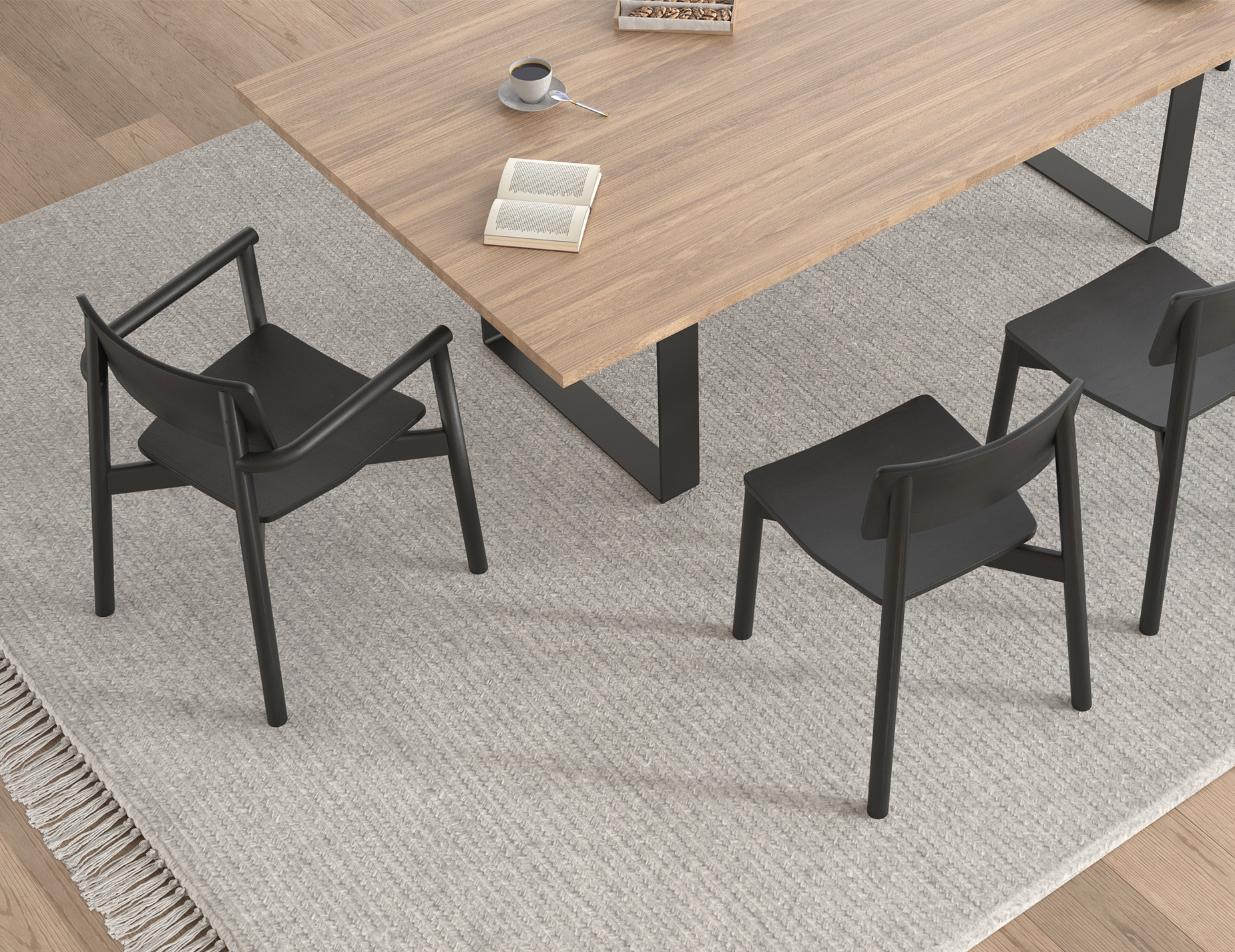Top angled view of Andi Dining Chair Black around a wooden dining table on textured rug, highlighting arrangement and modern dining setup.
