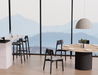 Modern open plan dining area with round table and large windows, styled with Andi Dining Chair Black in a bright contemporary interior.