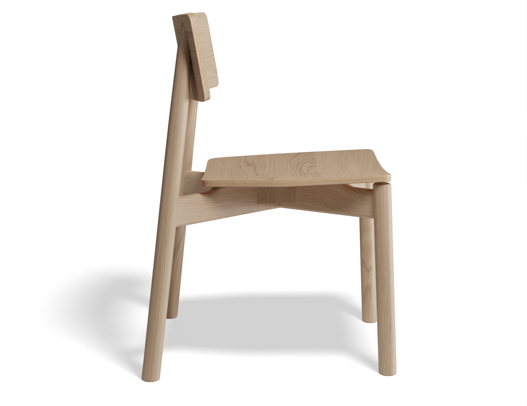 Side profile of Andi Dining Chair Natural highlighting sculpted seat and backrest in solid wood, minimalist furniture design.