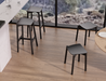 Top angled view of Andi Low Stool Black 45 cm seat height emphasising ergonomic seat contour and matte black wood grain texture