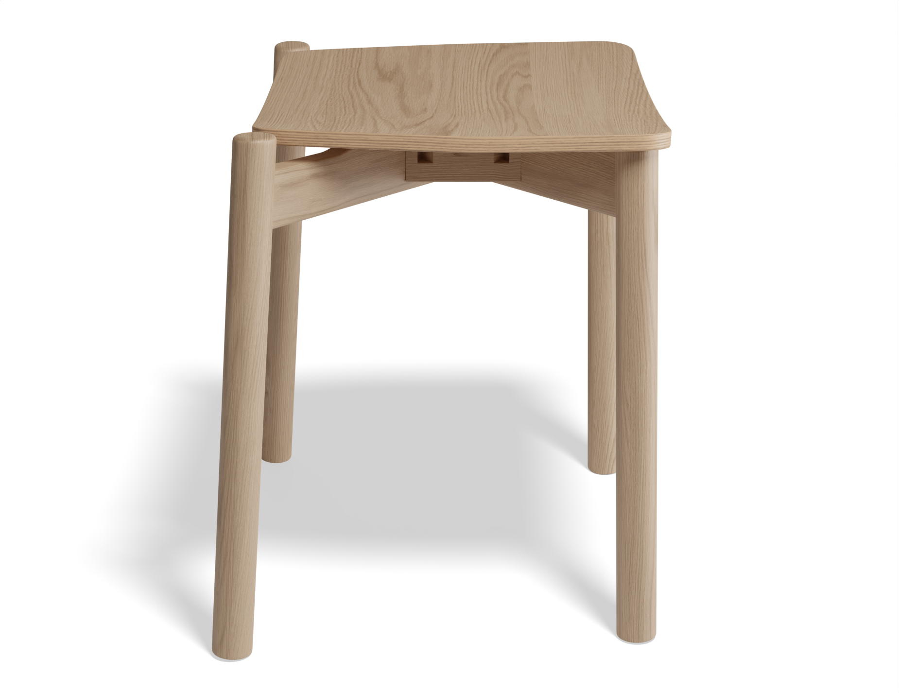 Front angled view of Andi Low Stool Natural 45 cm Seat Height isolated on white background, highlighting rounded corners and seamless wood construction.