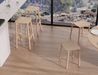 Top angled view of Andi Low Stool Natural 45 cm Seat Height emphasising ergonomic seat contour and clean joinery details.