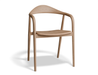 Slightly angled front view of a natural wooden armchair.