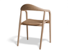 Slightly angled rear view of a natural wooden armchair.