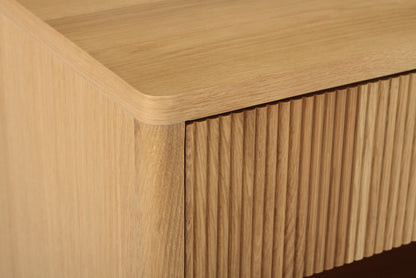 Close-up angled view of Harlow Bedside Table – Natural highlighting ribbed drawer front and smooth oak top
