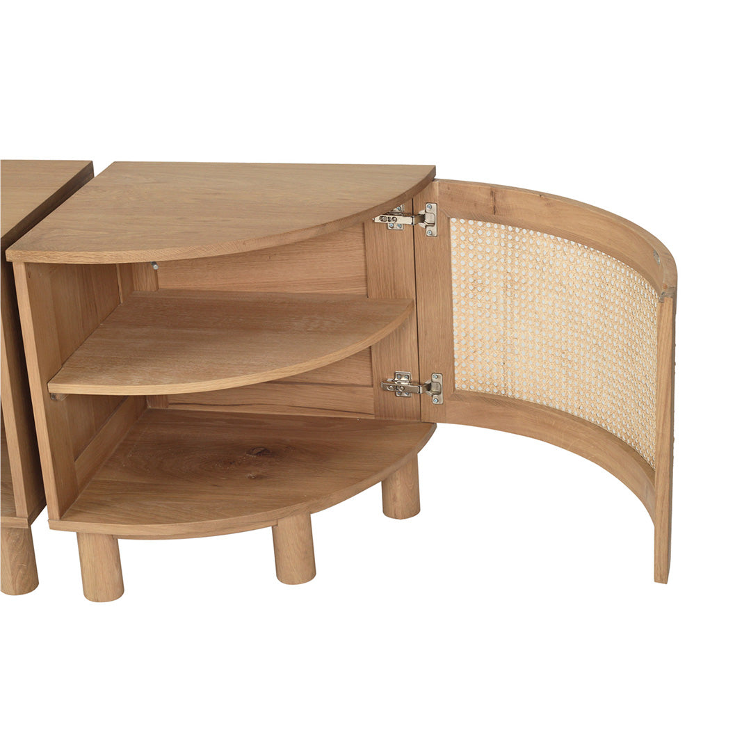 Open interior detail of Iluka Bedside Table – Natural showing two quarter‑circle oak shelves and cane‑lined curved door