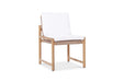 Angled view of Esperance Outdoor Dining Chair with teak base, woven rope seat, and plush white cushions.