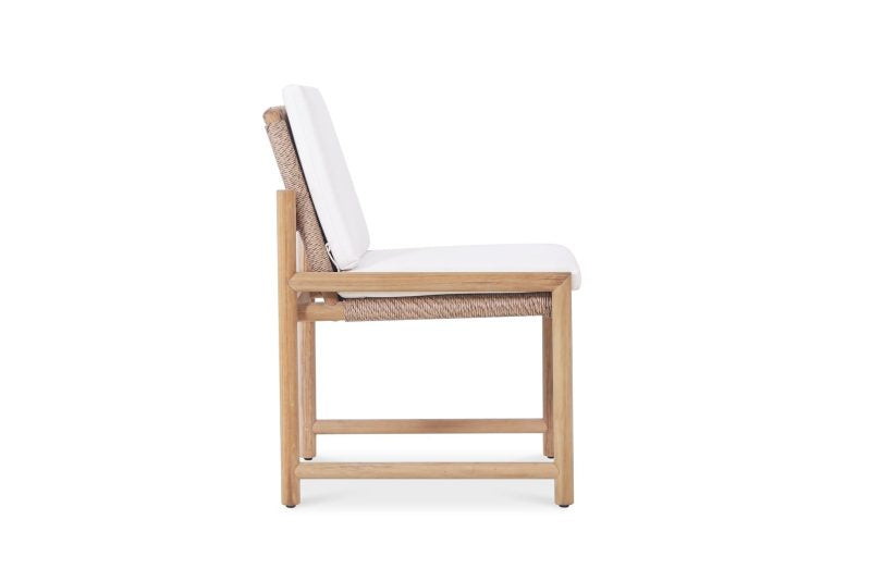 Side view of Esperance Outdoor Dining Chair with white cushion and hand-woven rope detailing on teak frame.