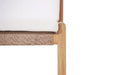 Close-up of Esperance Outdoor Dining Chair showing woven rope seat detail with teak frame and white cushion.