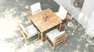 Top view of Esperance Outdoor Dining Chairs with square teak table in sunlit patio, featuring white cushions and minimalist design.