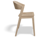 Side view of natural wood dining chair.