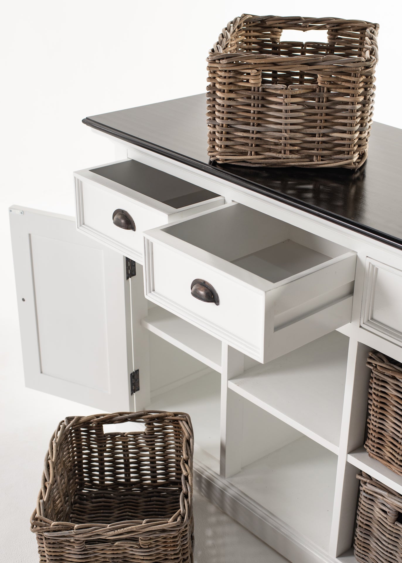 Close-up of the Halifax Contrast Buffet showing open drawers, open door storage and a rattan basket on the black timber top.