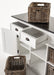 Close-up of the Halifax Contrast Buffet showing open drawers, open door storage and a rattan basket on the black timber top.