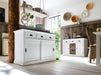 Lifestyle image of the Halifax Contrast Buffet with Sliding Doors in a bright dining room, styled with plates and another matching buffet in the background.