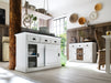 Lifestyle image of the Halifax Contrast Buffet with Sliding Doors styled in a bright dining space with white floors, timber wall panelling and woven accents.
