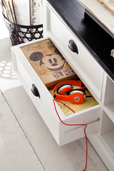 Close-up of an open drawer in the Halifax Contrast Large Entertainment Unit, styled with headphones and storage items.