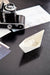 Close-up of a vintage camera and paper boat styled on the dark timber top of the Halifax Contrast Large Entertainment Unit.