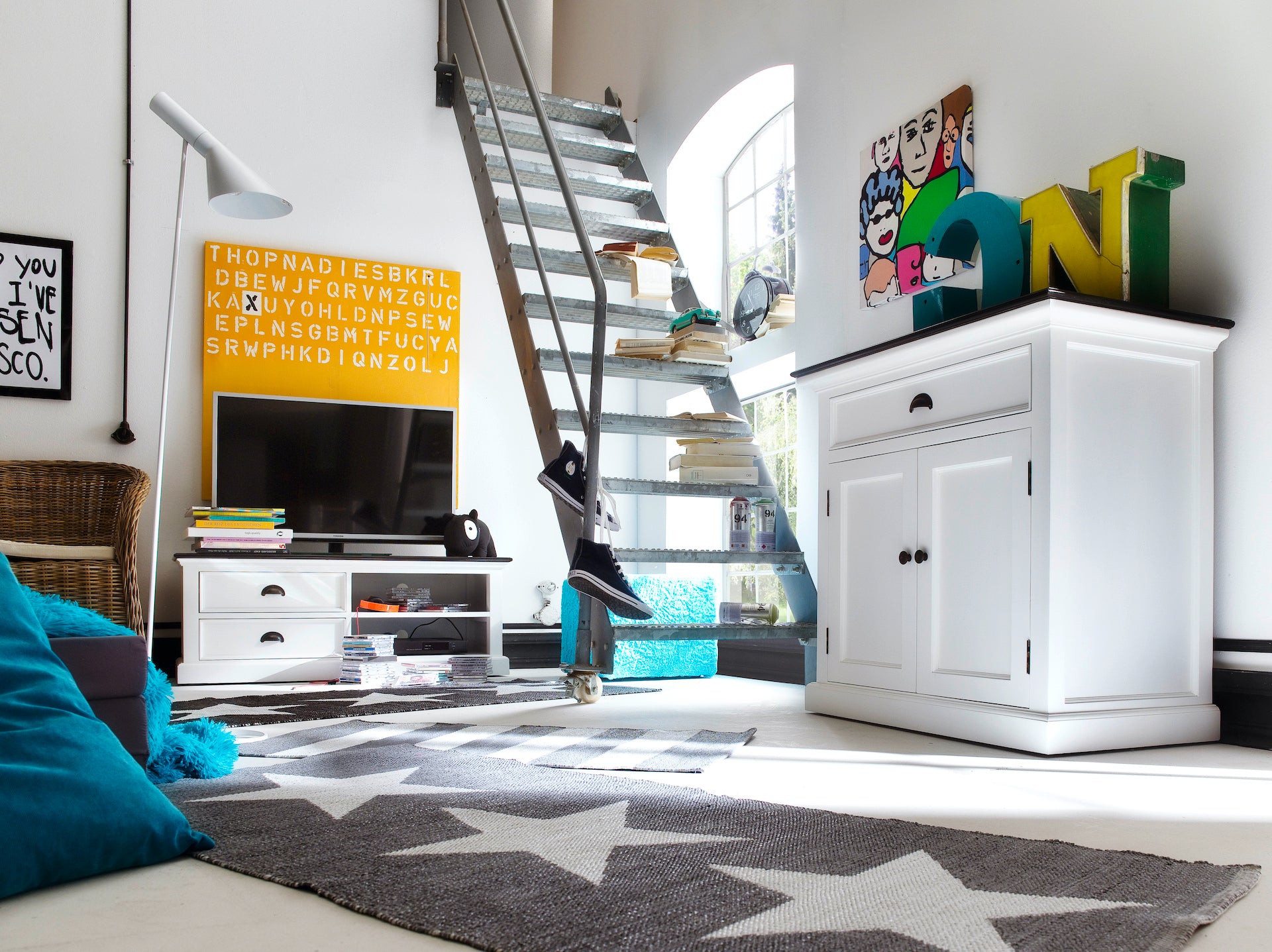 Lifestyle image of the Halifax Contrast Small Buffet in a bright living space, styled with a black timber top, white frame and matching entertainment unit.