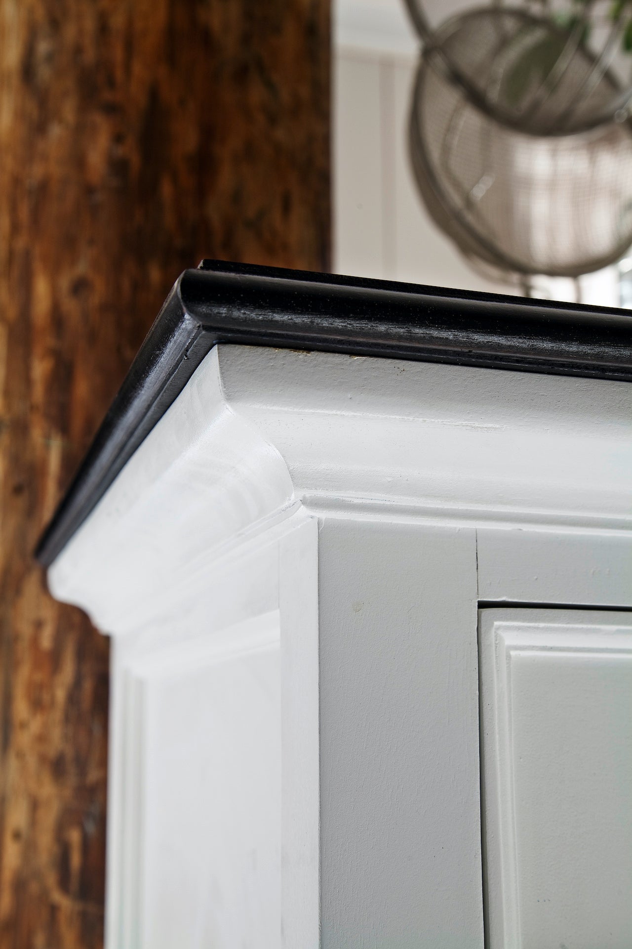 Close-up of the Halifax Contrast Small Buffet corner, showing the black timber top, white frame and classic moulded detailing.