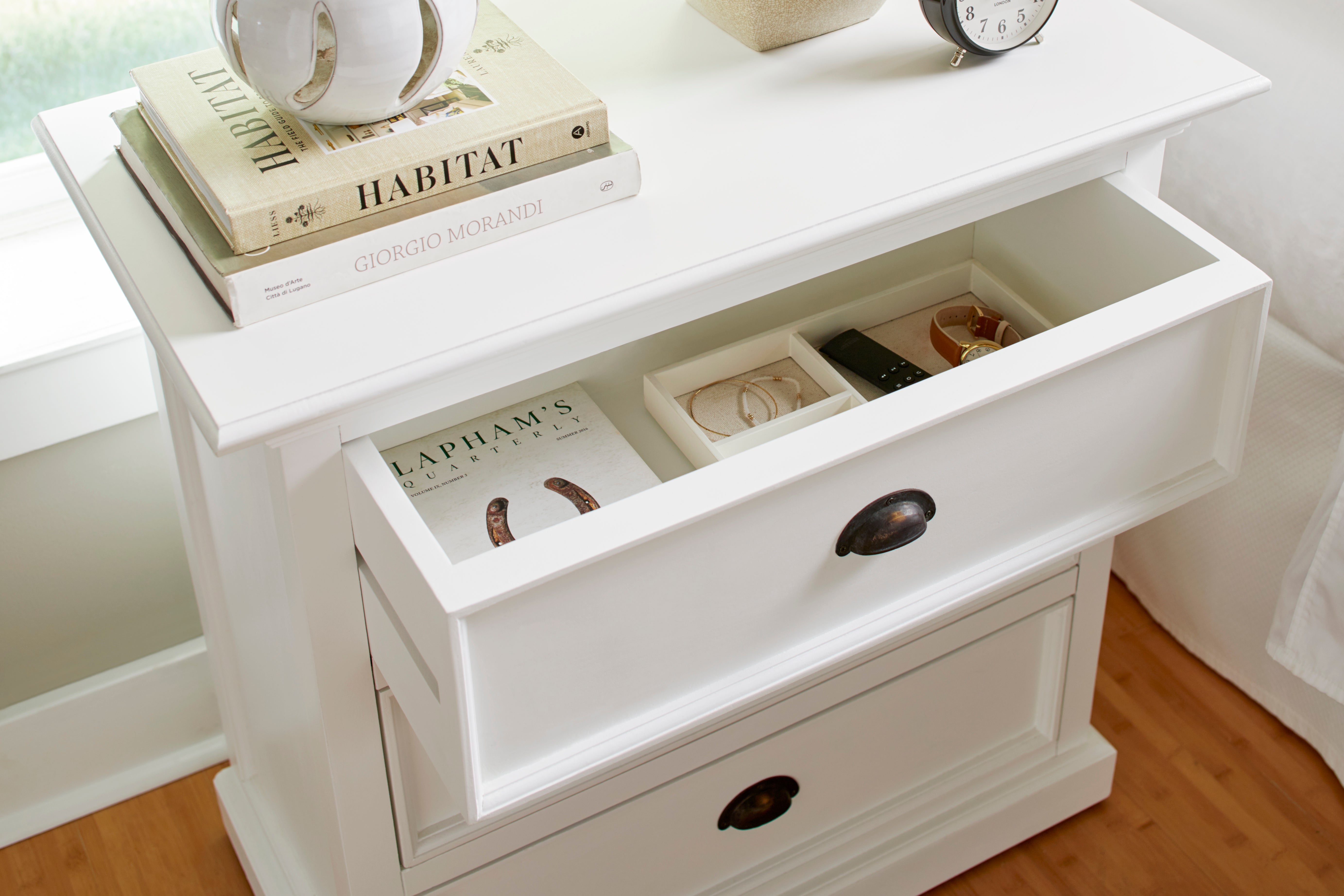 Close-up of the Halifax Grand Bedside Drawer Unit with the top drawer open, showing internal storage and styled bedside decor.