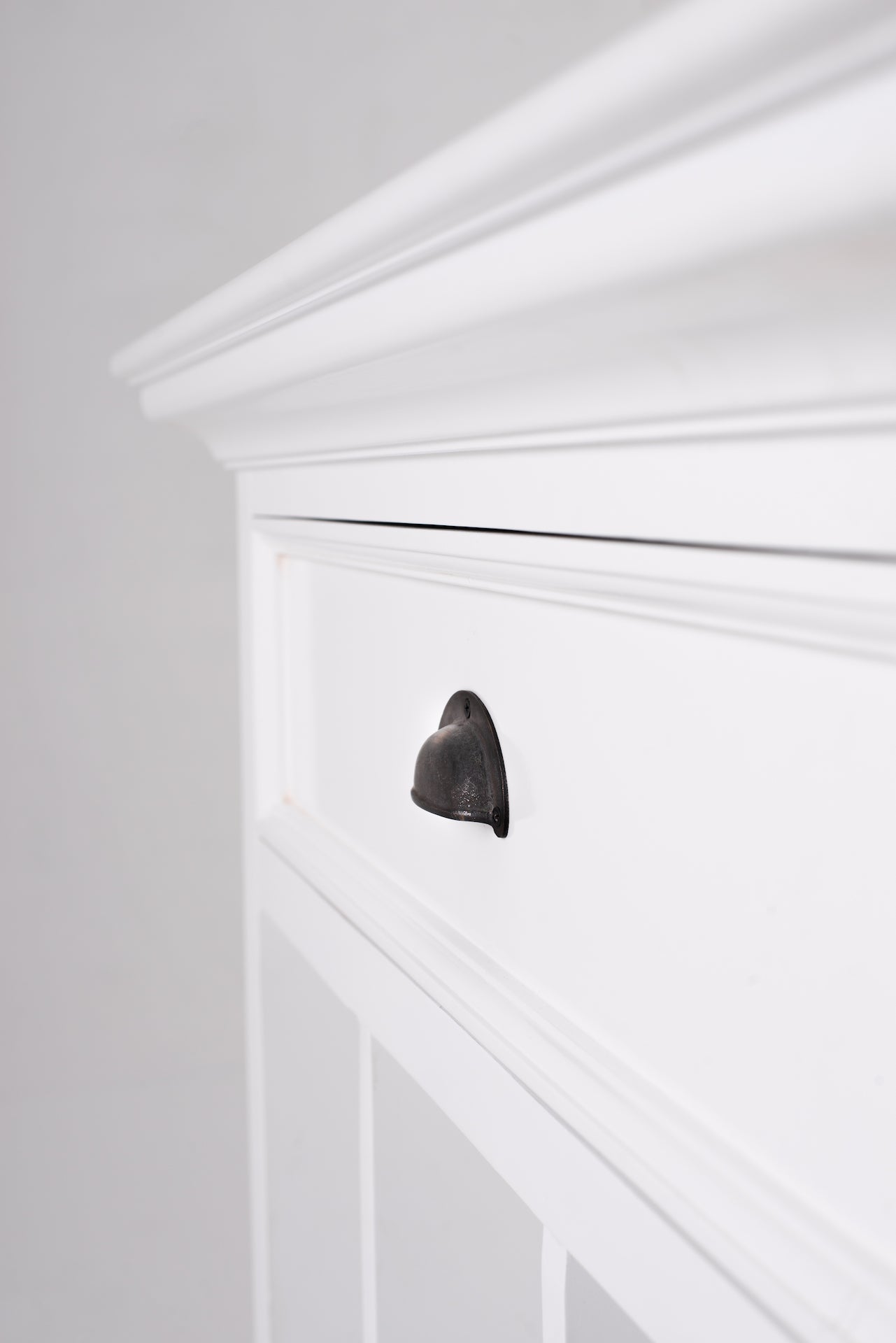 Close-up of the Halifax Grand Bedside Table with Dividers showing the white drawer front, black cup handle and moulded edge detail.
